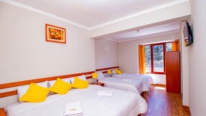 A hotel room with two beds, wooden headboards, white bedding, and a framed picture on the wall. - CUSCO HOUSE HOTEL (Cusco)