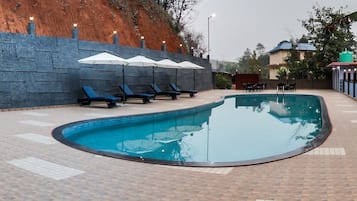 Outdoor pool, pool umbrellas, pool loungers