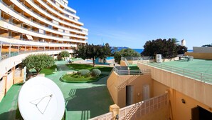 A multi-story hotel with balconies, a swimming pool, and a view of the sea. - Voramar by Interhome (Calpe/Calp)