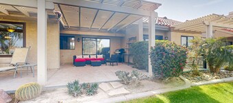 Water-view home on golf course with hot tub, pool, tennis, on-site golf, & patio