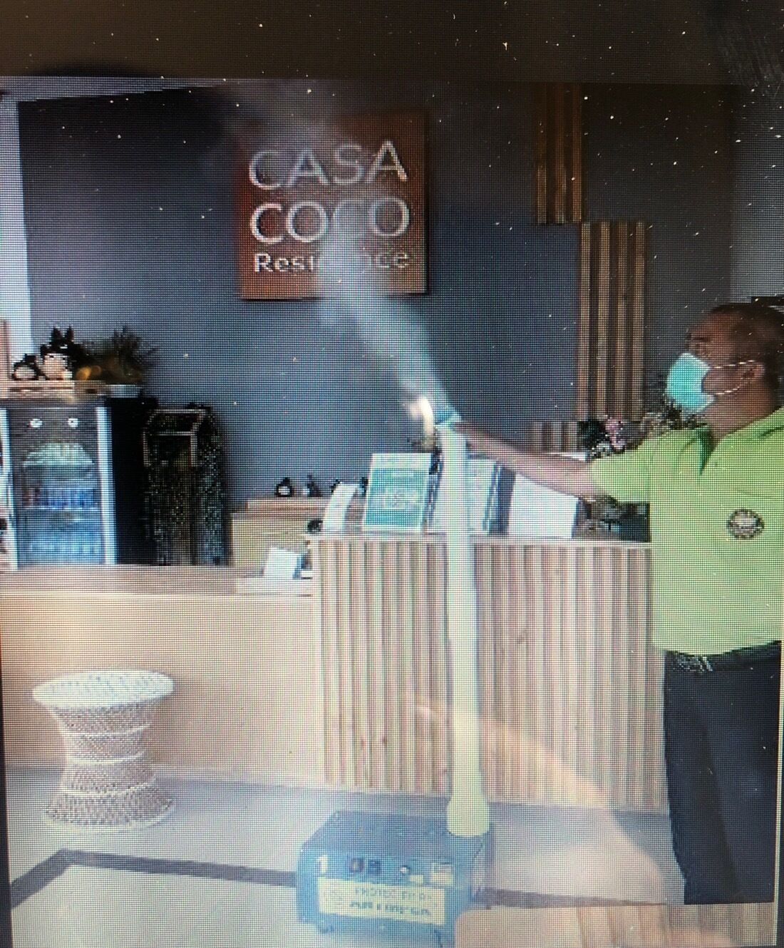 A reception area with a sign reading "CASA COCODO Residence".