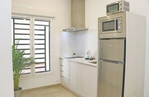 Microwave, coffee/tea maker, toaster, cookware/dishes/utensils