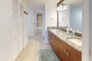 Shower, hair dryer, towels, shampoo