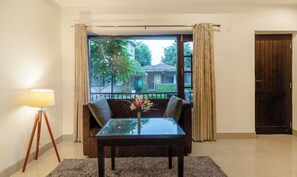 Deluxe Room | Desk, blackout drapes, soundproofing, iron/ironing board - Treebo Tiger Pug Mark Resort with Pool (Kaladhungi)