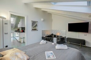 Family Apartment, Multiple Bedrooms (Loft & Jacuzzi) | 2 bedrooms, iron/ironing board, free WiFi, bed sheets - Loft & Jacuzzi (Riva del Garda)