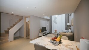 Superior Suite | Living area | 43-inch Smart TV with cable channels, first-run movies