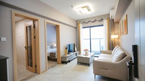 Business Suite, City View | Living area | 43-inch Smart TV with cable channels, first-run movies