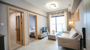 Suite Affaires, vue ville | Coin séjour