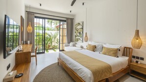 A modern bedroom with a large bed, a desk, and a view of greenery outside. - Vista Villa Ubud (Ubud)