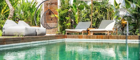 Outdoor pool, pool umbrellas, sun loungers
