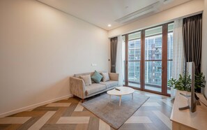Deluxe Apartment, 1 Bedroom, Balcony, City View | Living area | 42-inch Smart TV with digital channels, Netflix, streaming services - The Galleria Residence-ANGIA Hospitality (Ho Chi Minh City)