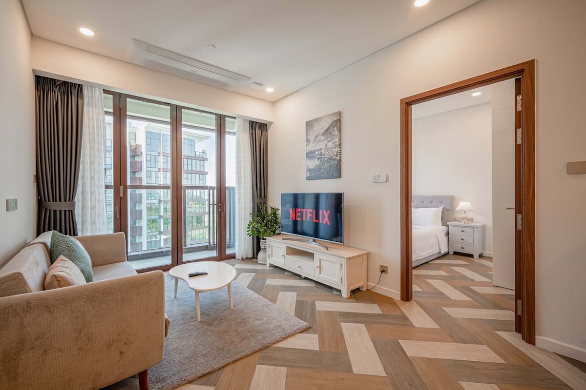 Deluxe Apartment, 1 Bedroom, Balcony, City View | Living area | 42-inch Smart TV with digital channels, Netflix, streaming services