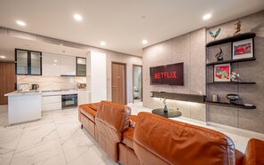 Deluxe Apartment, 3 Bedrooms, Balcony, City View | Living area | 42-inch Smart TV with digital channels, Netflix, streaming services - The Galleria Residence-ANGIA Hospitality (Ho Chi Minh City)
