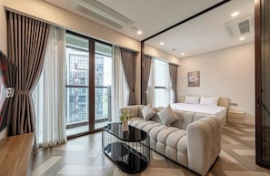 Deluxe Apartment, 1 Bedroom, City View | Living area | 42-inch Smart TV with digital channels, Netflix, streaming services - The Galleria Residence-ANGIA Hospitality (Ho Chi Minh City)