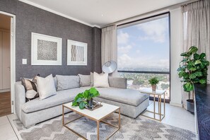 Luxury Apartment | Living area | Smart TV, Netflix, streaming services - Oasis Apartments at Masingita Towers (Sandton)