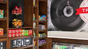 A grocery store with shelves stocked with snacks, fruits, and beverages. - Hampton Inn & Suites By Hilton Pittsboro (Pittsboro)