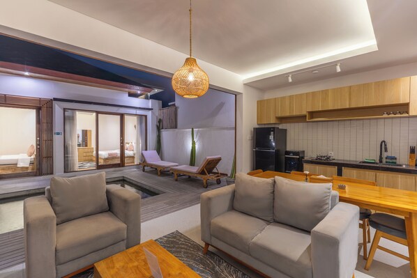 Deluxe Villa | Living room | 24-inch flat-screen TV with cable channels