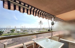 Enjoy breathtaking views of the marina and cityscape from this balcony.