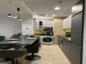 Fridge, microwave, oven, stovetop - Exquisite 1BR with Captivating City View (Dubai)