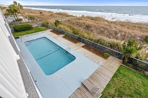 A rooftop pool with a view of the ocean and beach. - Windy Shores Unit 205 - Oceanfront (North Myrtle Beach)