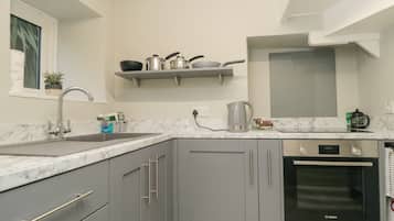 Fridge, electric kettle, toaster, cookware/dishes/utensils