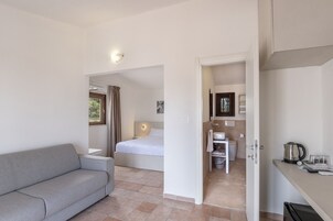 Premium bedding, desk, laptop workspace, blackout drapes