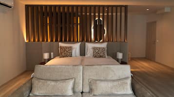 Suite Deluxe | 1 habitación, ropa de cama de alta calidad y minibar