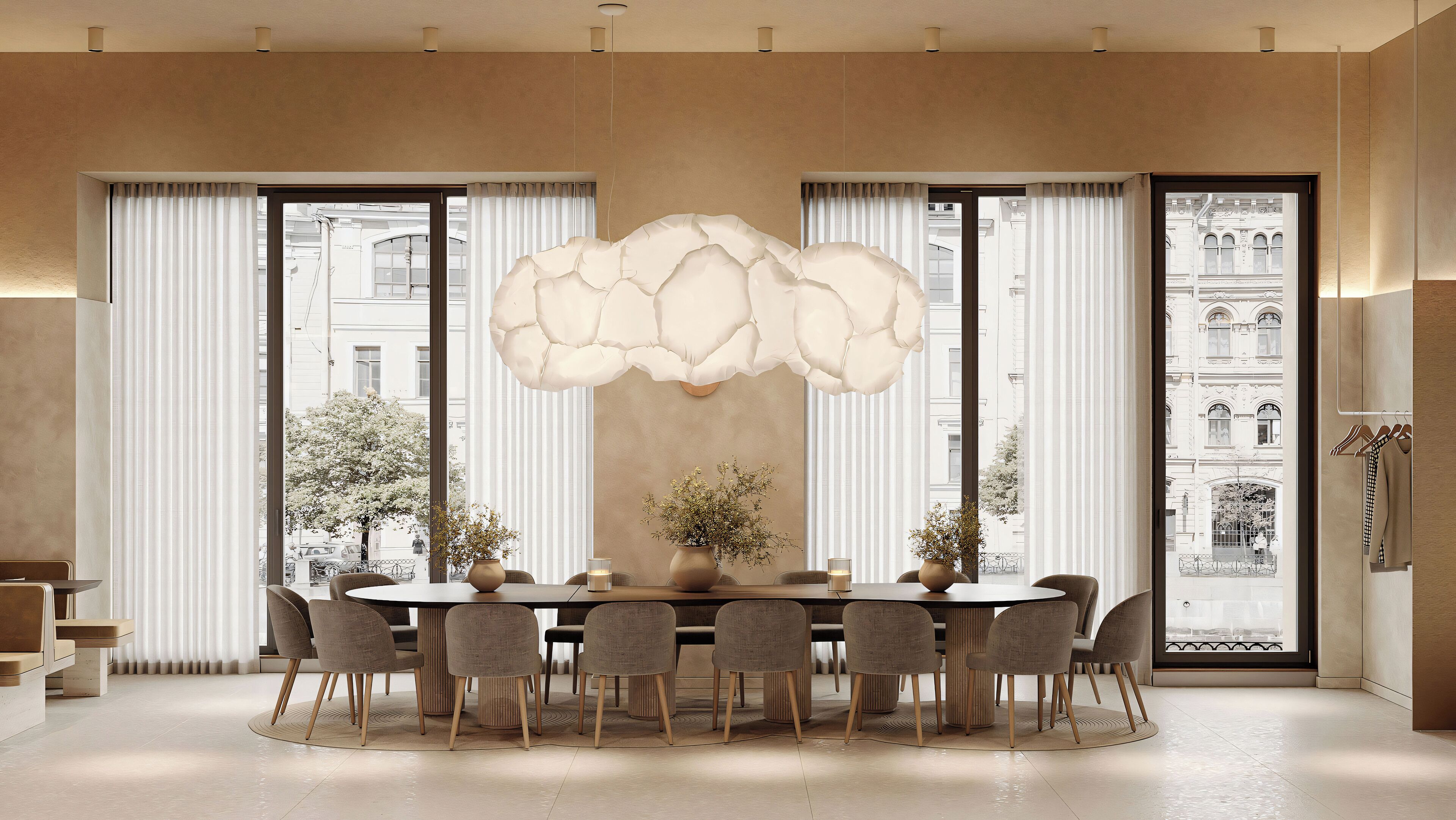 A modern dining room with a round table, chairs, and a decorative ceiling light.