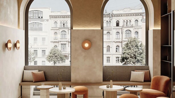 Un salón moderno con ventanas arqueadas, una lámpara central y diferentes disposiciones de asientos.