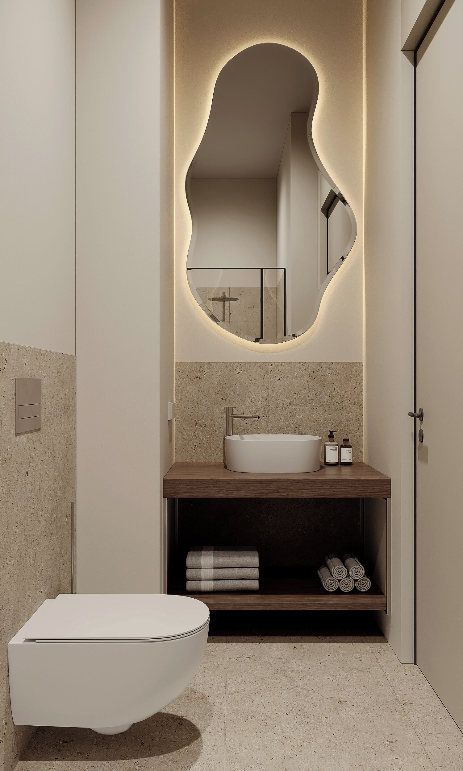 Een moderne badkamer met een vrijstaand bad, een wastafelmeubel met een wastafel en een spiegel met een bijzondere gebogen lijst.