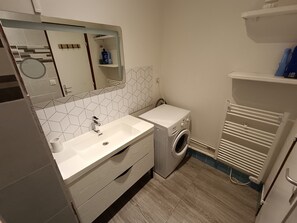 Shower, hair dryer, towels, toilet paper