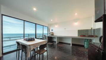 Villa | Private kitchen | Full-sized fridge, microwave, oven, griddle