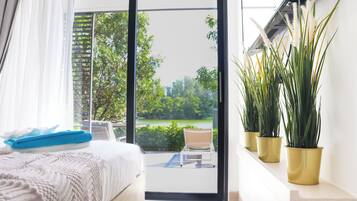 Family Apartment, Patio, Partial Sea View | In-room safe, individually decorated, individually furnished