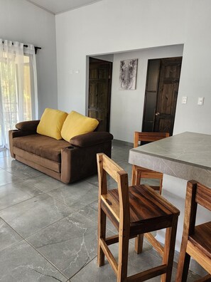 Family Bungalow, 2 Bedrooms, Poolside | Living area | Smart TV, streaming services - EcoVillas las Melinas  (Tamarindo)