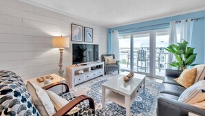 Living area - Intracoastal and Gulf of Mexico water views from this hideaway unit complete with heated pool, hot tub & home office (Indian Shores)