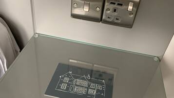 A glass table with a printed map of a building layout.