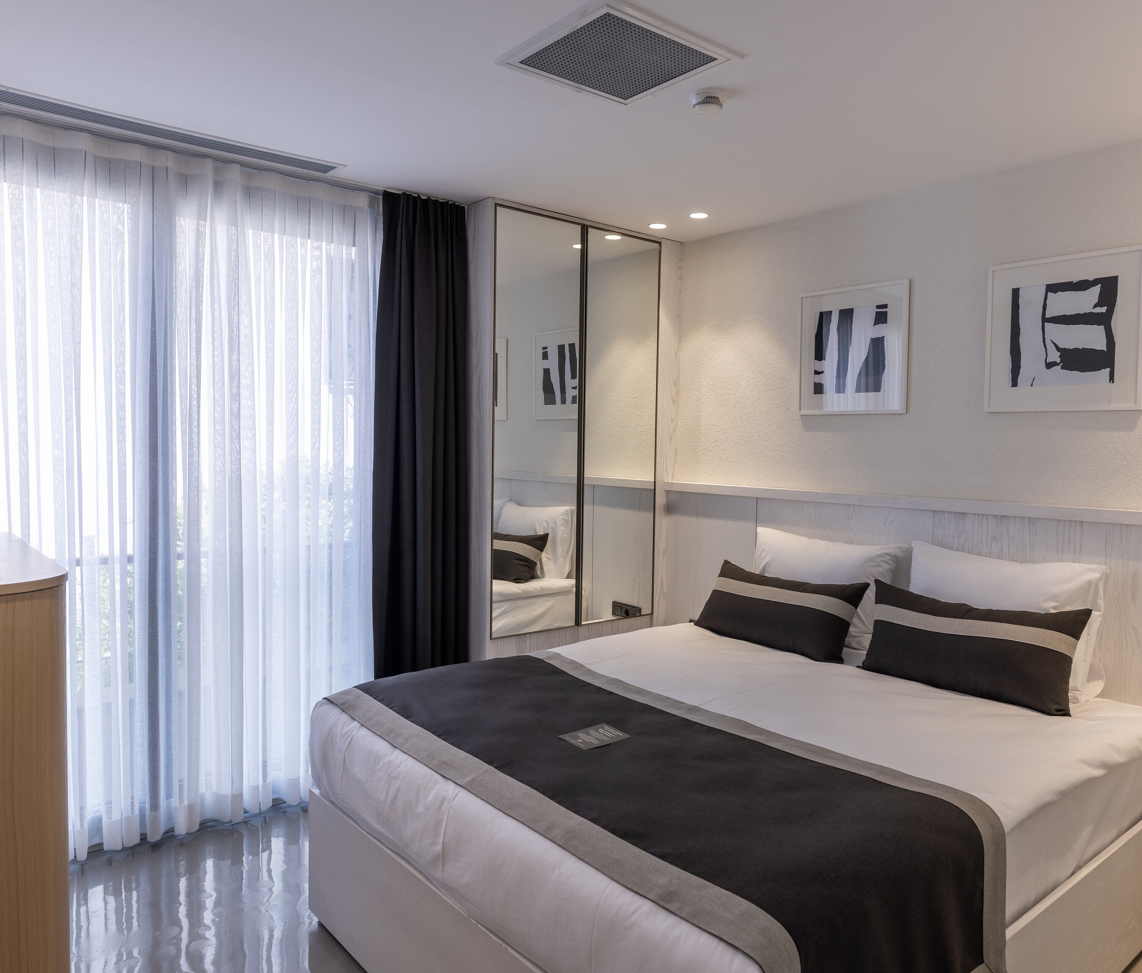 Premium bedding, blackout drapes, soundproofing, iron/ironing board