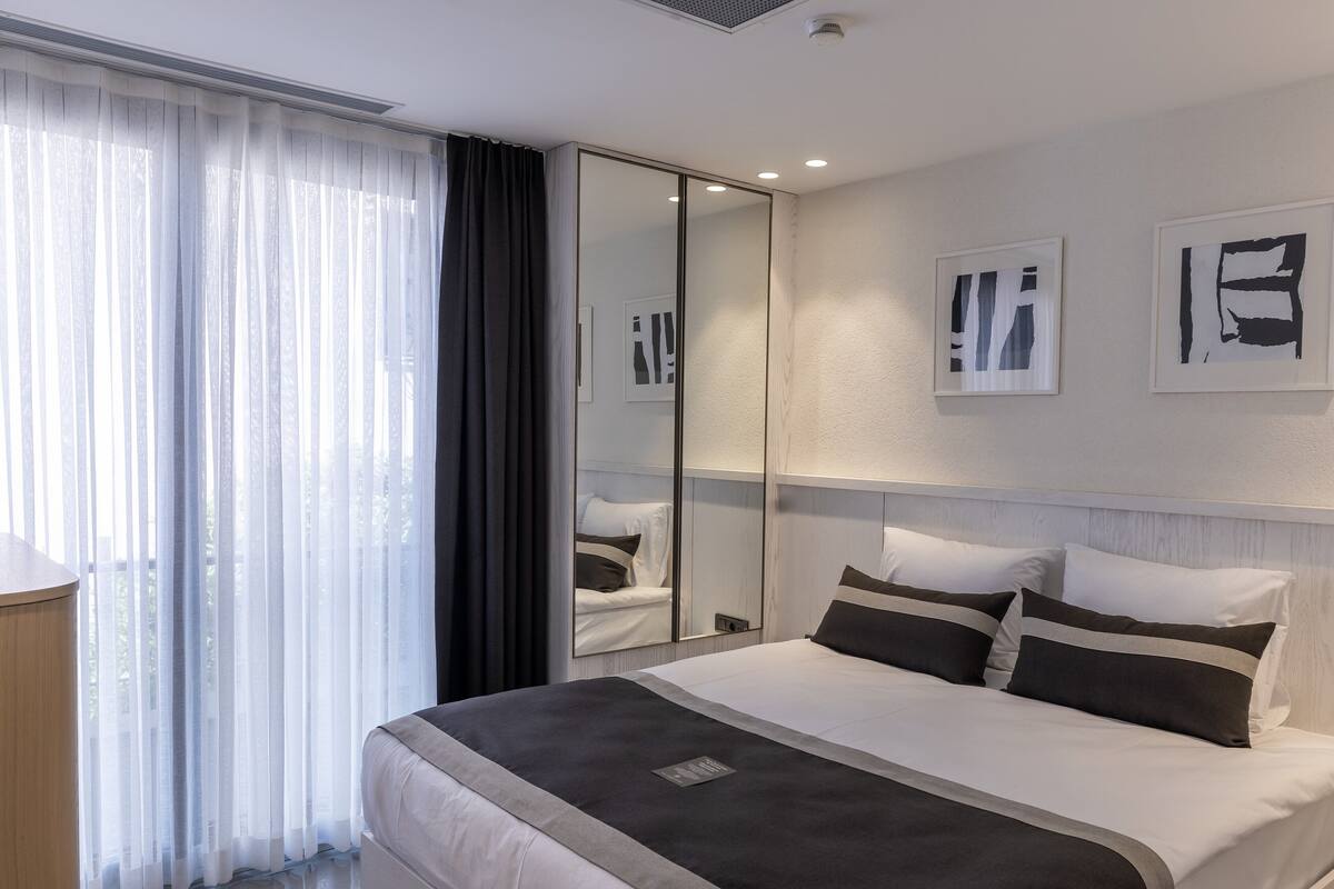 Premium bedding, blackout drapes, soundproofing, iron/ironing board