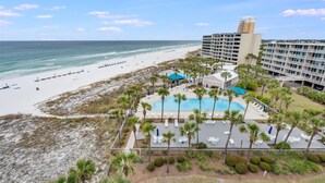 A resort with a beach, a swimming pool, and a high-rise building. - Book Now for Fall! Oceanfront! (Panama City Beach)