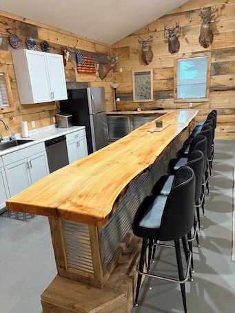 Fridge, microwave, oven, stovetop. Large cabin with ATV/UTV trail access.