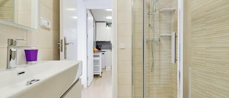 Shower, hair dryer, towels, soap