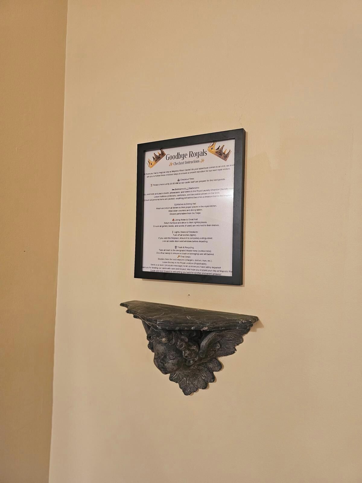 A framed sign with checkout instructions for a hotel, including sections for rooms, dining, and trash disposal.