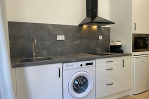 Fridge, microwave, stovetop, coffee/tea maker