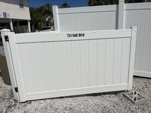 A white metal gate with "714 Gulfi Blvd" written on it. - Cottage by the Sea Unit A
Indian Rocks Retreat- 3-Minute Walk to Beach- King Bed (Indian Rocks Beach)