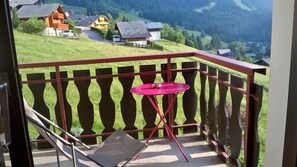 Enjoy the serene view of the surrounding countryside from this balcony.