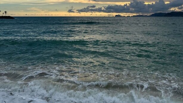 A coastal view with clear skies and calm sea.