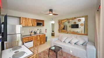 Comfort Apartment, City View | Living area | 50-inch Smart TV with cable channels