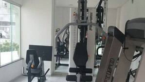 A gym with various exercise equipment, including a treadmill and weight machines. - A 300 Mtos da Arena da Amazônia e Centro de Convenções Vasco Vasquez (Chapada)