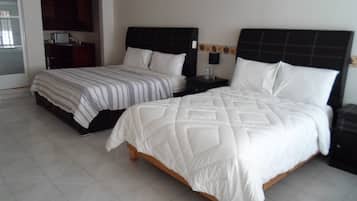 Suite familiar, varias camas, cocina | Edredón, wifi gratis y ropa de cama