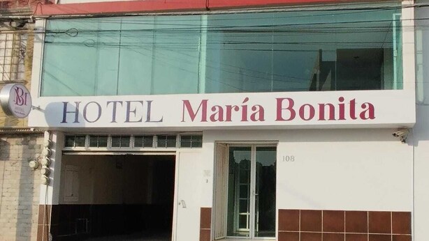 A hotel named "Maria Bonita" with a visible entrance and a number "108" on the facade. - Hotel María Bonita (Tlaxcala)